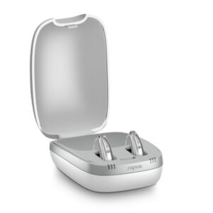 An open signia hearing aid holder with two aids